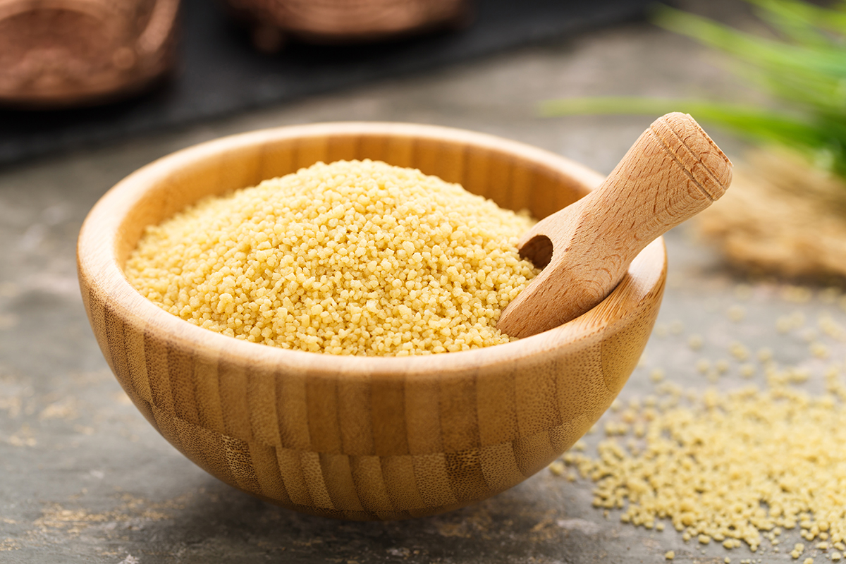 Stockfoto - Couscous in a wooden bowl